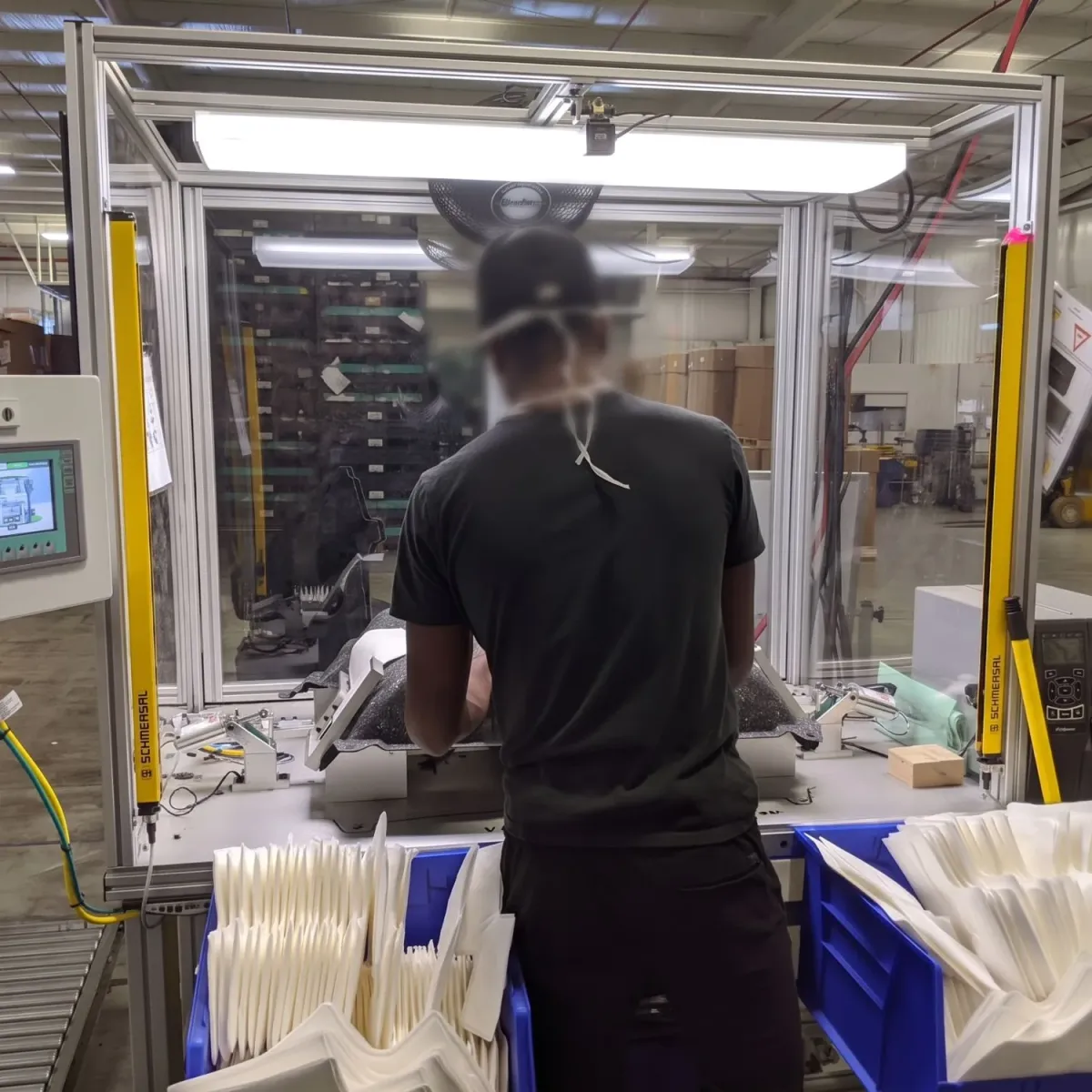 The verification station in production with light curtains, vision checks and label printer